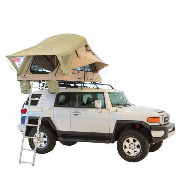 Beige rooftop tent setup on SUV for camping