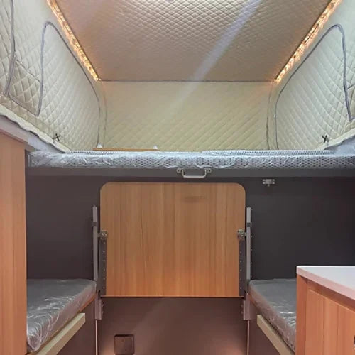 Interior sleeping area with retractable bed platform and insulation