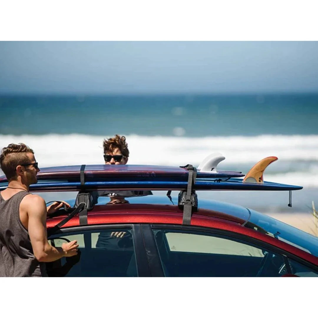 people loading surf boards on Yakima EasyTop Temporary Roof Rack