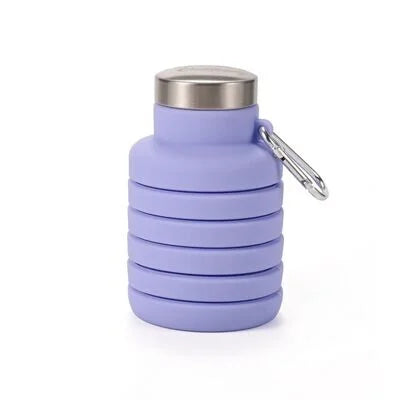 Purple collapsible silicone water bottle fully collapsed with cap attached