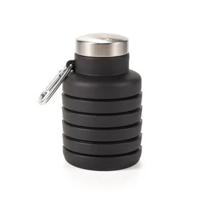 Black collapsible silicone water bottle fully collapsed with cap attached