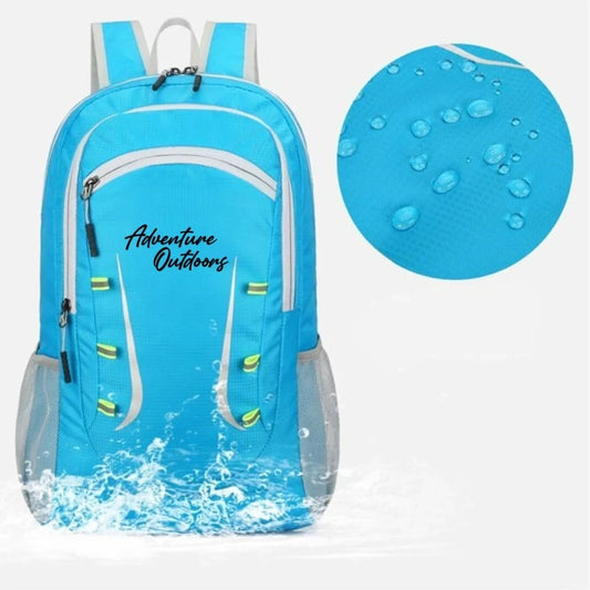 Bright blue Adventure Outdoors foldable hiking backpack with water splash and waterproof material close-up