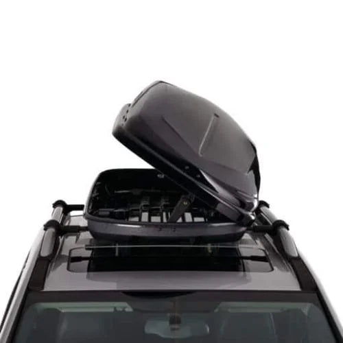 Rear angle of CCM Rooftop Cargo Box mounted on a vehicle with lid open, showing interior access