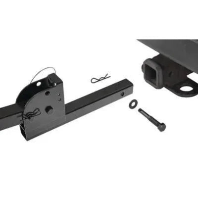 Close-up view of CCM hitch components, including pin, bolt, and hitch adapter for 1.25" and 2" receivers