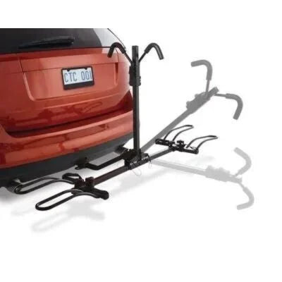 CCM 2-Bike Carrier mounted on red SUV, rear view showing platform extended and ready for bikes