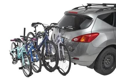 CCM 2+2 Bike Carrier attached to SUV carrying four adult bikes on a 2-inch hitch