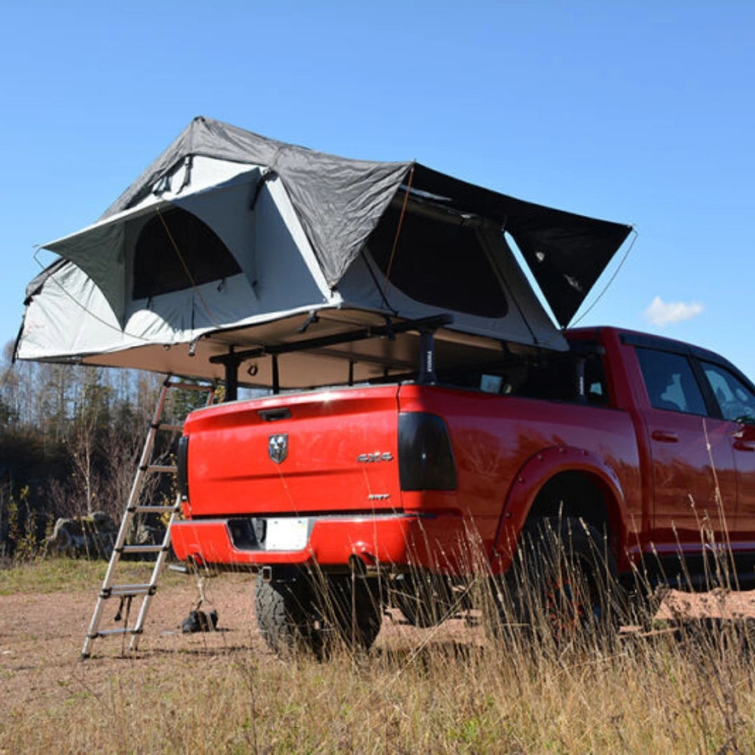 Enthuze 4 Person Rooftop Tent set up on red truck in nature