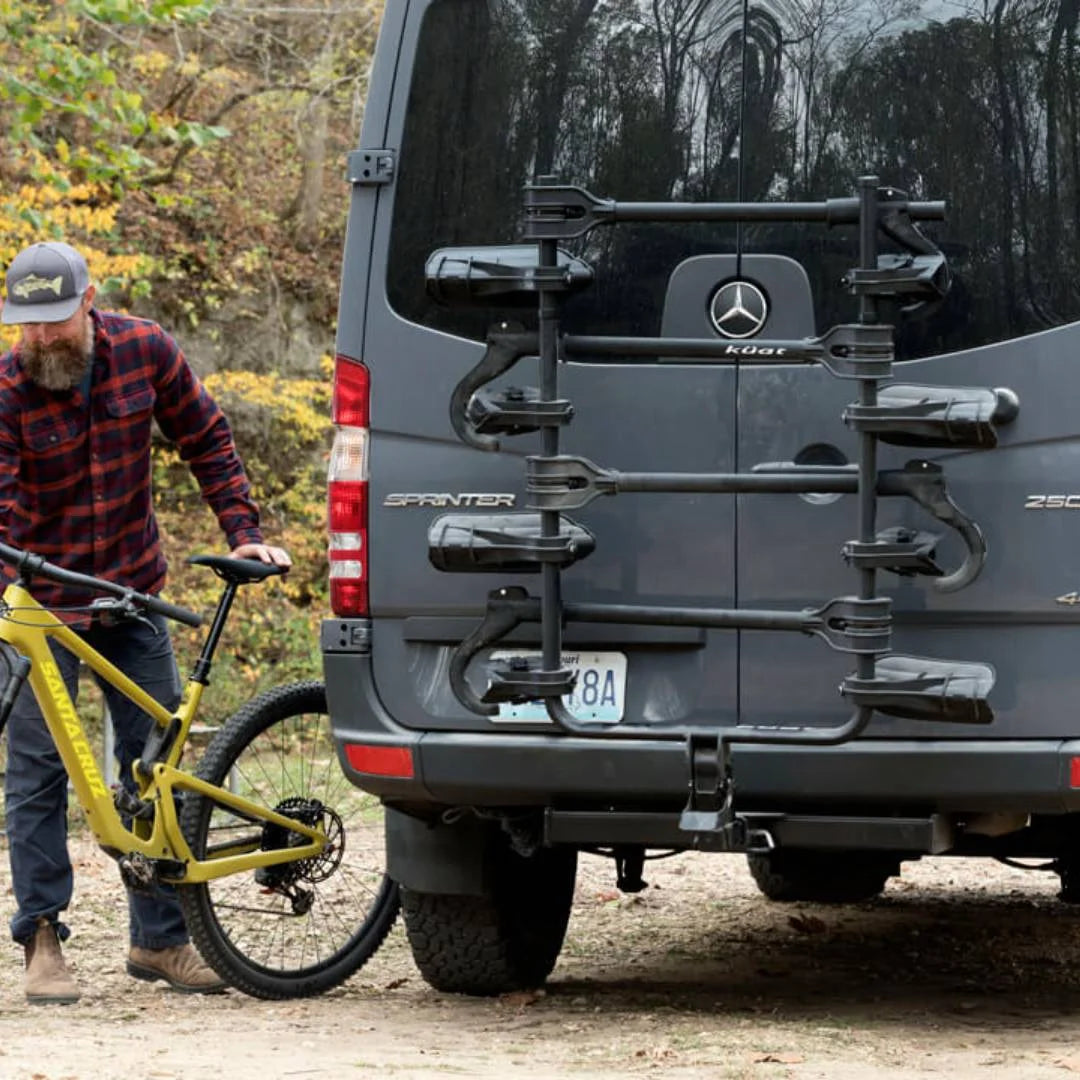 Rear view of Kuat rack with two bikes mounted on a Jeep