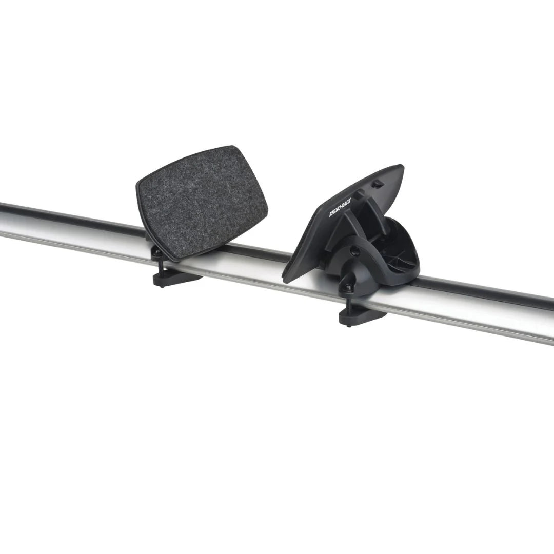Angled view of rear felt-covered cradles from the Rhino-Rack Nautic 571 kayak carrier attached to roof crossbars.