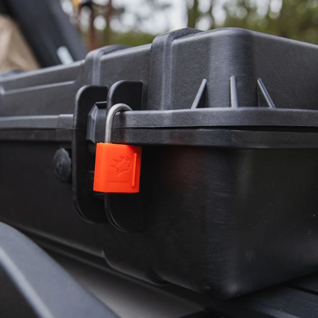 Close-up of Rhino-Rack Cargo Case latch with red padlock.