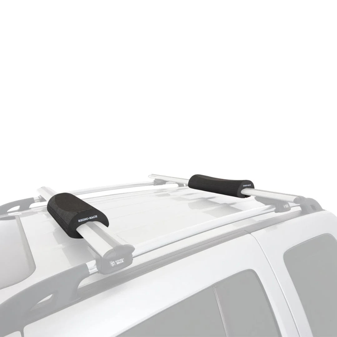 Rhino-Rack Vortex Foam Wrap Pads installed on silver vehicle roof crossbars.