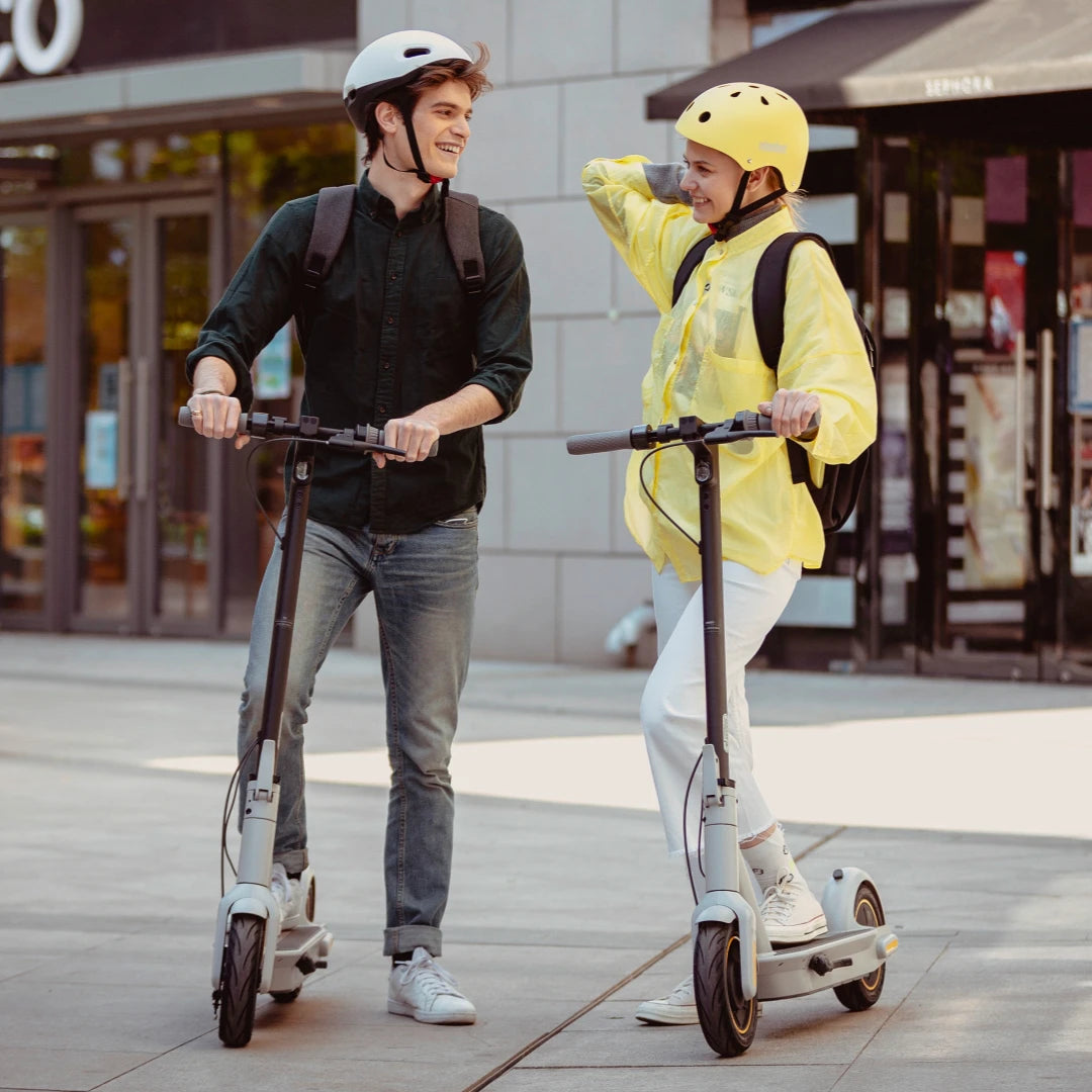 2 people riding Segway Electric Scooter