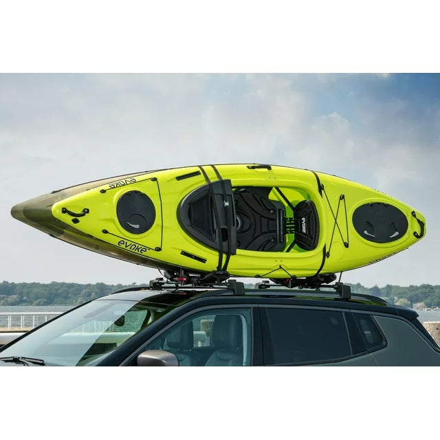 Green kayak secured on vehicle roof using Swiss Cargo 3-in-1 Kayak Carrier.