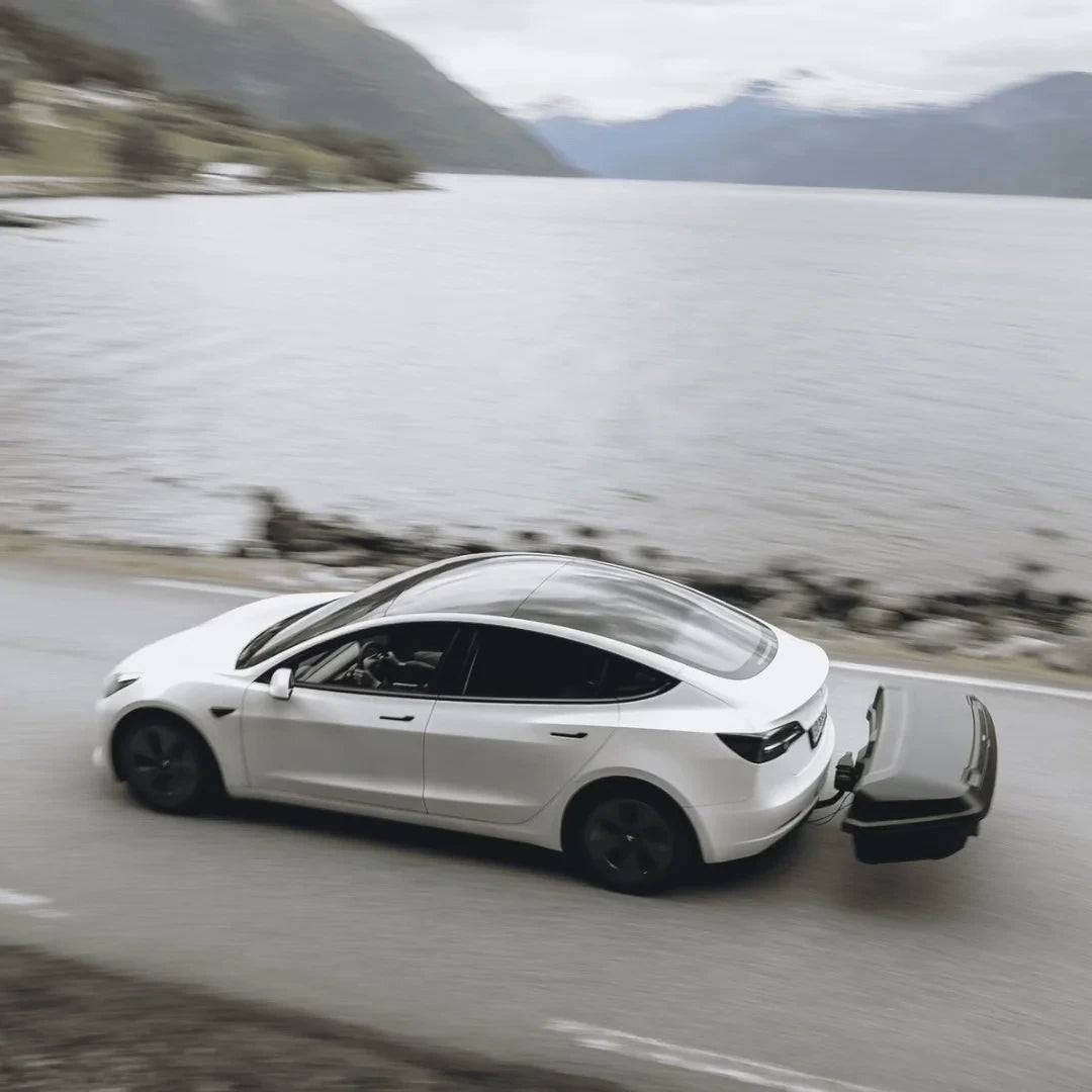 Thule Arcos Box & Platform Bundle Box on white car driving along ocean road