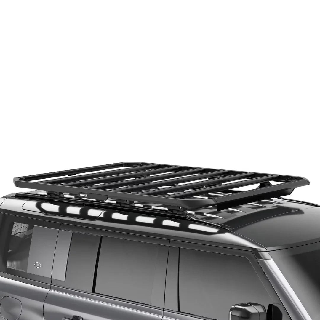 Thule Caprock Platform installed on the roof of a black van, showcasing its low-profile fitment.