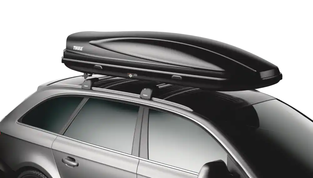 Close-up view of the cargo box mounted on the roof rails of a silver SUV.