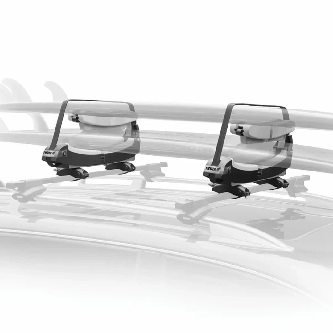 Thule surfboard carrier with two padded cradles installed on a vehicle roof rack