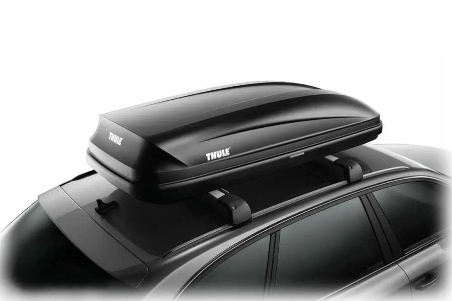 Thule Pulse cargo box angled on a roof rack, mounted on a black vehicle.