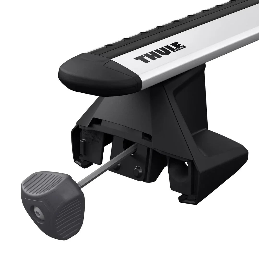 Thule Torque Key Tool inserted into Thule foot pack mounted on vehicle crossbar.