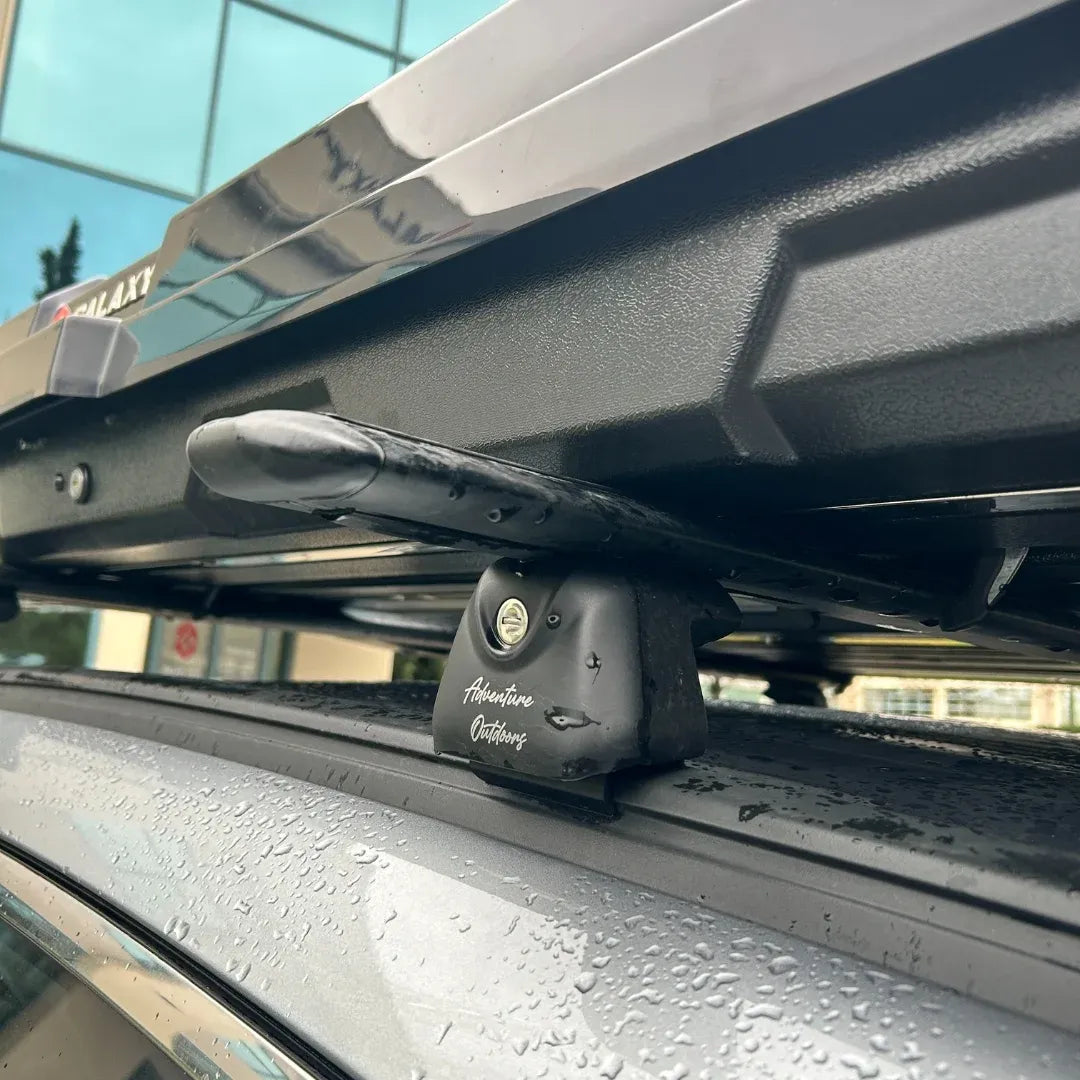 Close-up of AO alpine cargo box mounting hardware secured to crossbars