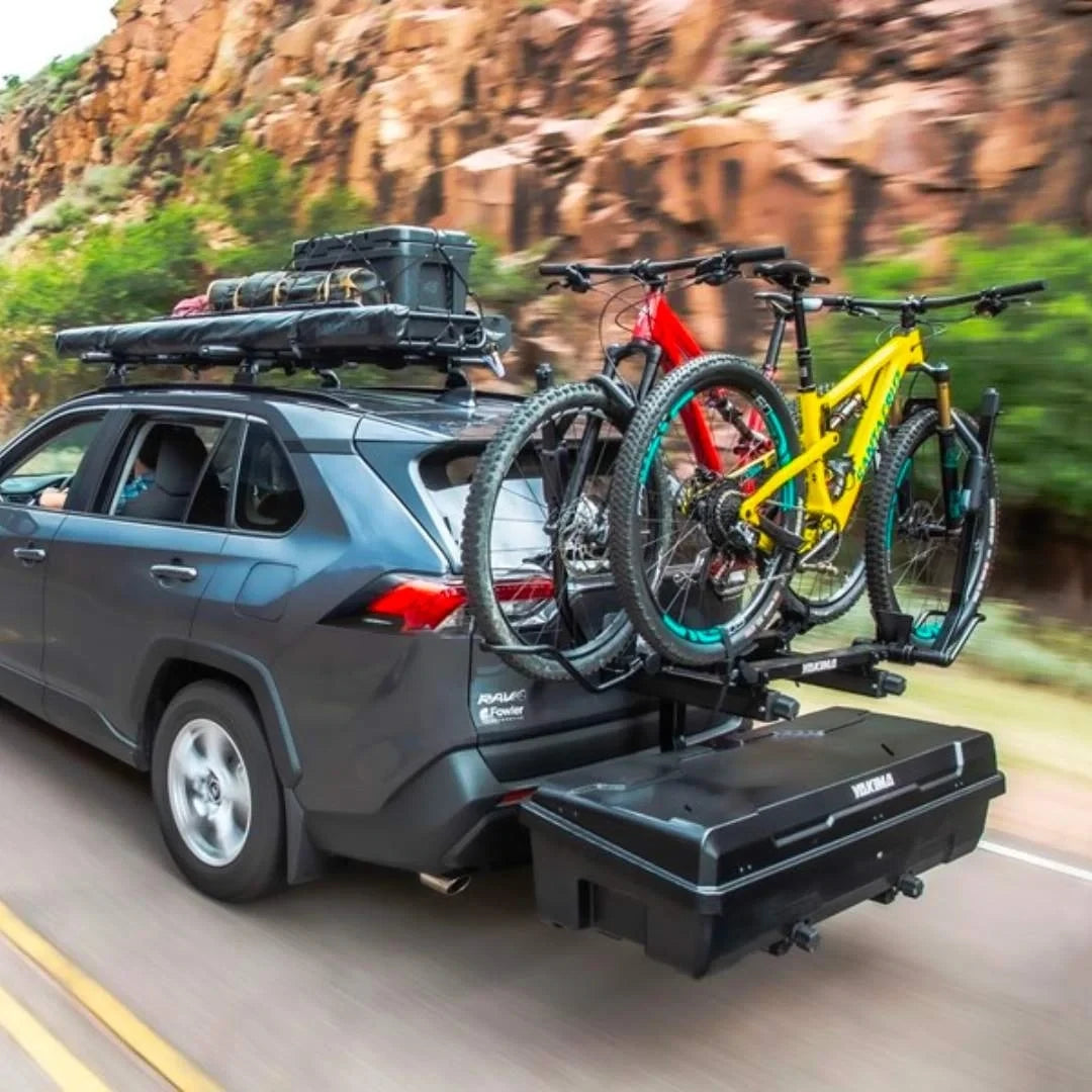 Yakima EXO GearLocker on car hitch of driving car