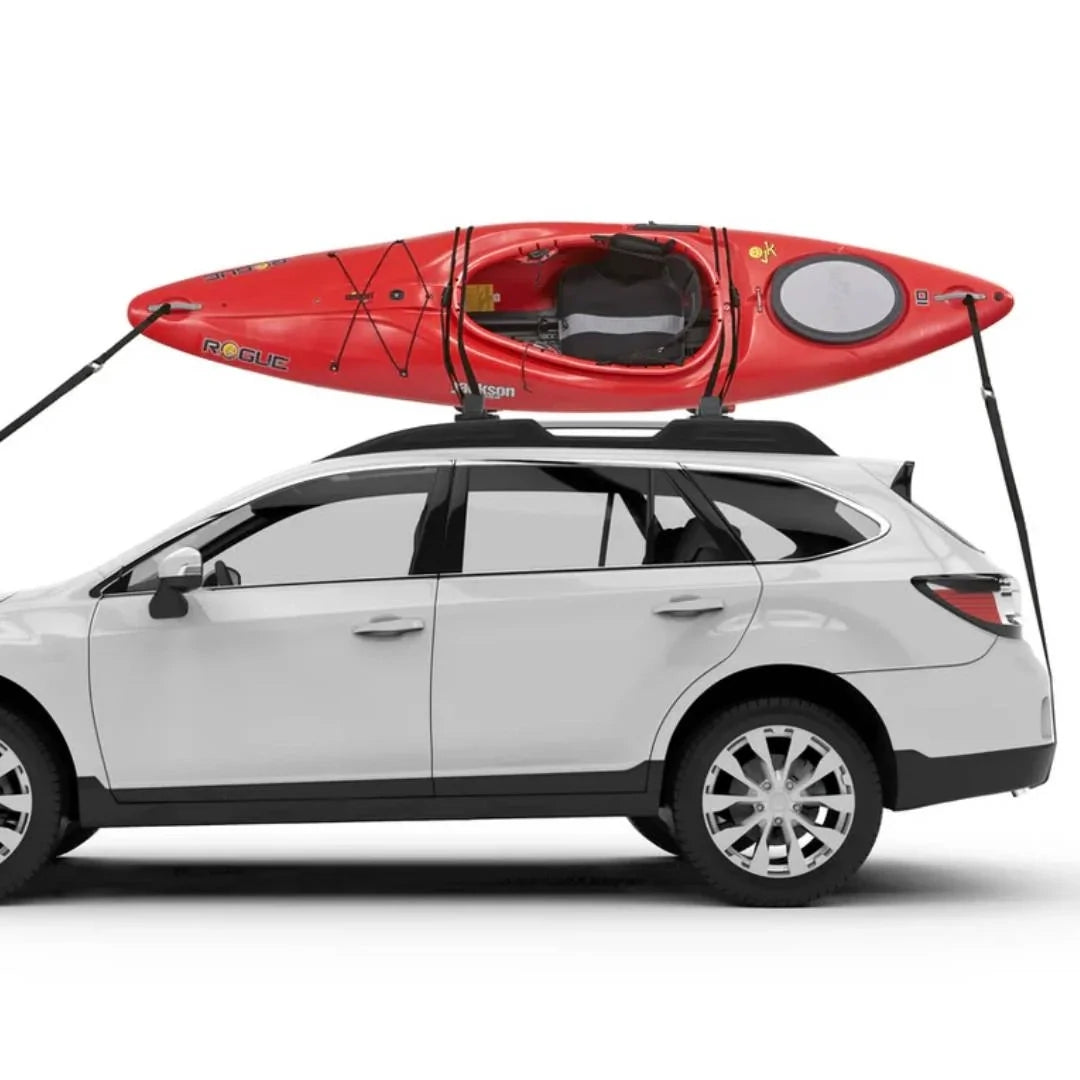 Yakima JayLow Kayak Mount strapped red Kayak on white car - sideview