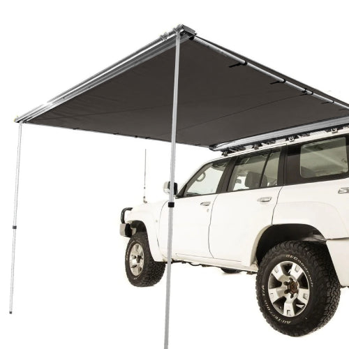 Heavy-duty AO Rooftop Awning with integrated LED lights set up on off-road 4x4 vehicle for rugged adventures
