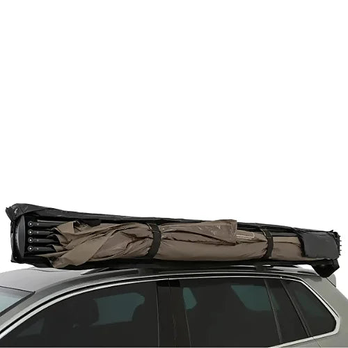 Folded Rhino-Rack Batwing Compact Awning strapped to crossbars for storage