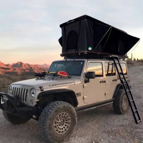 2025 Camp-In AO Aluminum Pop-Up Rooftop Tent mounted on Jeep Wrangler at sunset