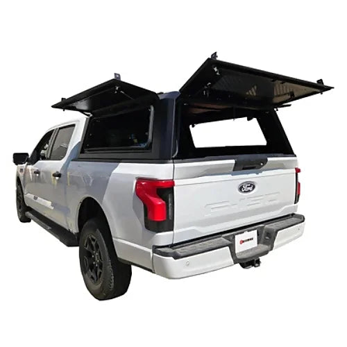 Rear side angle of Dodge Ram 1500 & Ram Classic 5.7' bed stainless steel canopy with gullwing side doors open, shown on Ford F150 for reference.