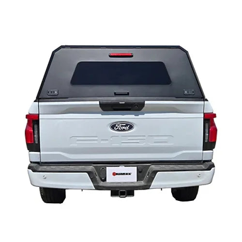 Stainless steel canopy rear straight view for Dodge Ram 1500 and Ram Classic 5.7' bed, shown mounted on Ford F150 for display.