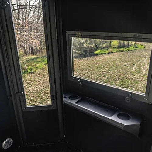 Elevated Hunting Blind interior window with viewing area and built-in shelf for gear