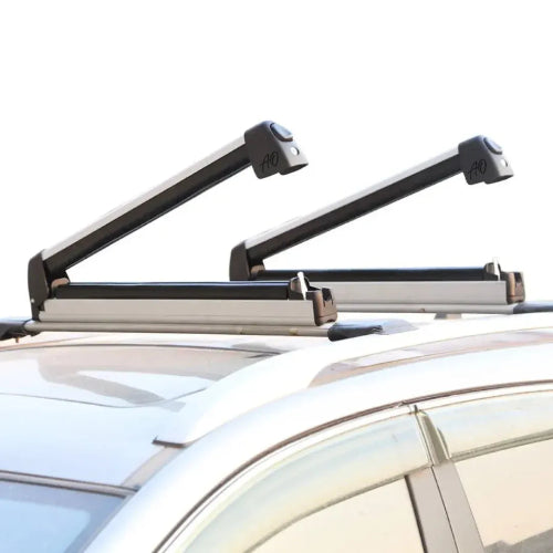 Side view of Full-Pull AO Extender slide-out ski snowboard rack mounted to roof crossbars, showing raised arm clearance and compact profile
