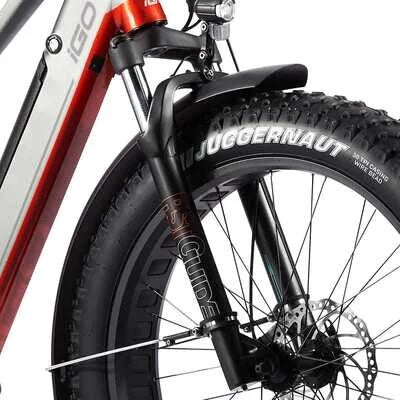 Zoomed-in view of the bike’s front suspension fork and Juggernaut Sport fat tire.