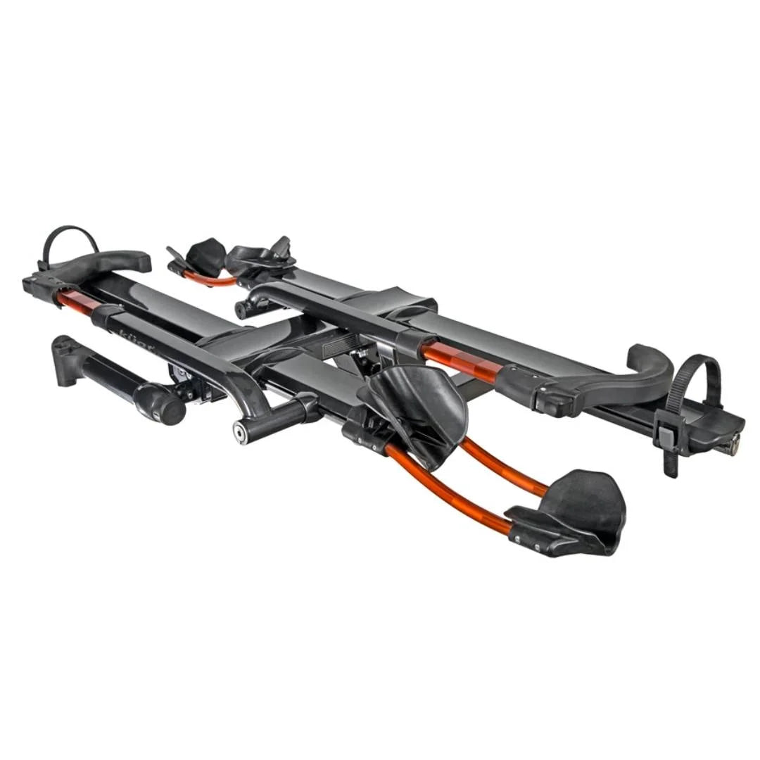 Angled front view of the Kuat NV 2.0 hitch bike rack showing trays and arm supports.