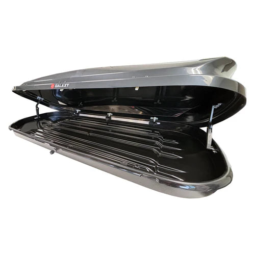 Large alpine rooftop cargo carrier fully open with spacious long interior for skis and snowboards