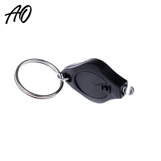 Black AO mini flashlight keychain on white background with AO logo