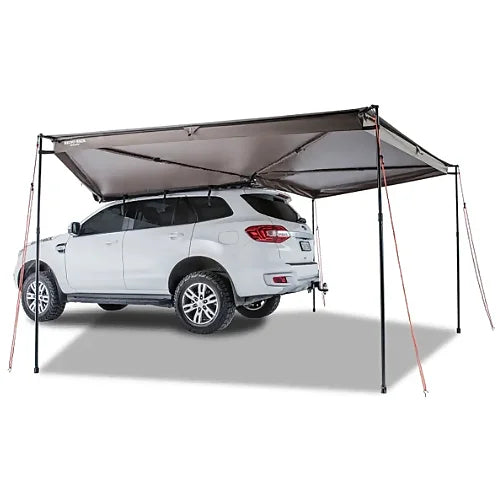 Rear angle showing Rhino-Rack Batwing Awning fully extended over SUV