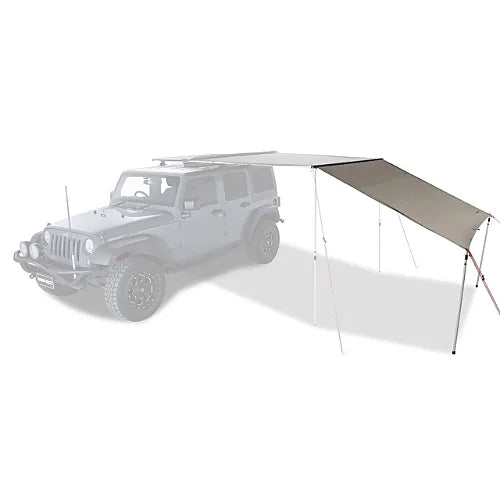 Awning extension shown staked to ground at angle for shade and wind protection