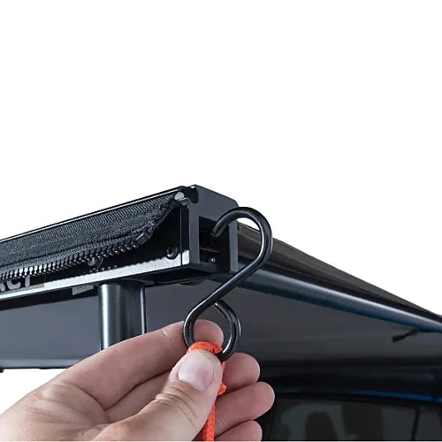 Rhino-Rack Sunseeker 2.5m awning shown mounted on side of SUV