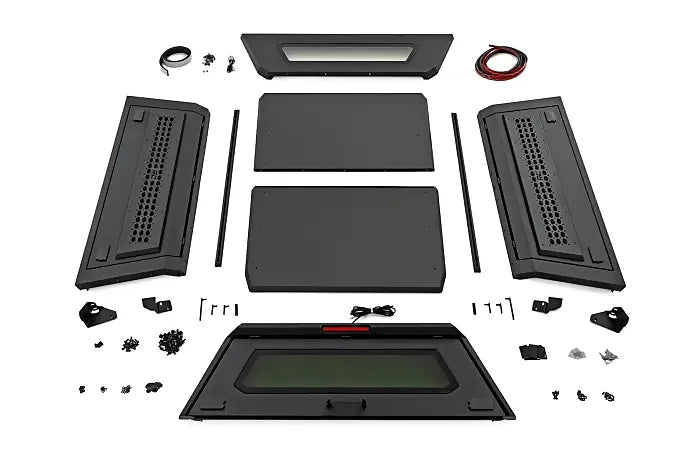 Rough Country modular overland truck canopy kit with panels, MOLLE doors, wiring, and hardware for Ford F-150 and Ram 1500 pickup installation