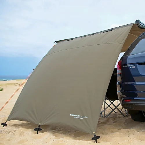 Sunseeker Side Wall set up on SUV on sandy beach providing privacy and shade