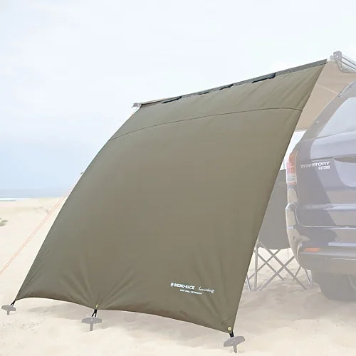 Standalone Sunseeker Awning Side Wall displayed on beach with pegs and guy ropes
