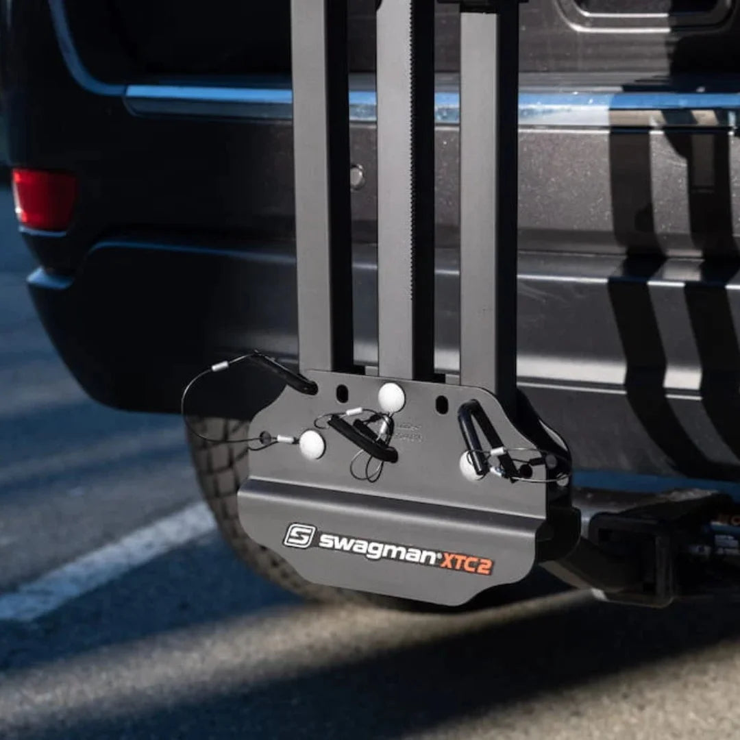 Close-up of the Swagman XTC base plate mounted on a vehicle hitch.