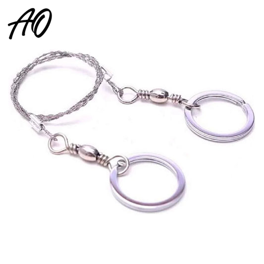 Adventure Outdoors tactical wire saw with stainless steel twisted wire and two circular keyring handles against white background.