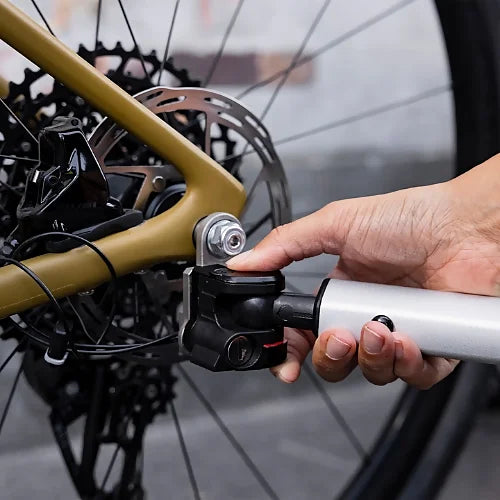 Close-up of Thule Chariot Sport 2 hitch arm quick-attach system showing secure, one-handed bike connection mechanism