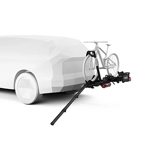 Ramp attached to hitch rack with white bike being loaded