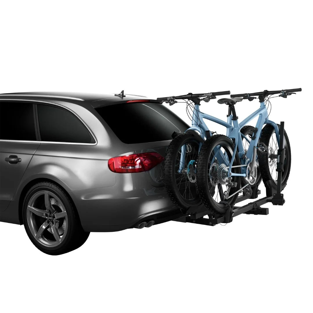 Two bikes mounted on the Thule T2 Classic rack attached to the rear of a grey SUV.