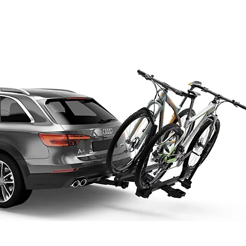 Thule T2 Pro X bike rack mounted on car with two mountain bikes