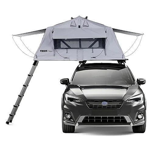 Front view of Thule Tepui Explorer Ayer 2 rooftop tent mounted on a vehicle with ladder fully extended